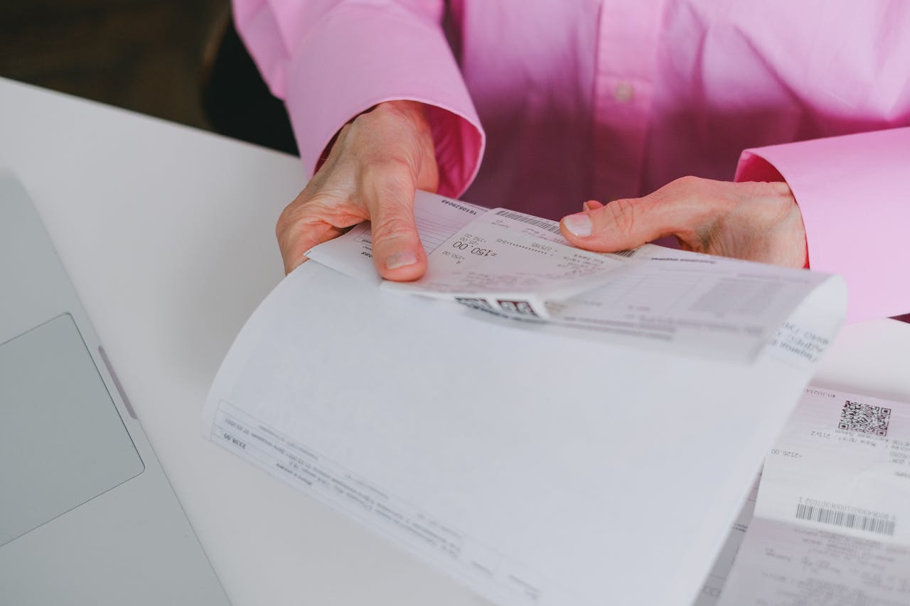 person holding receipts